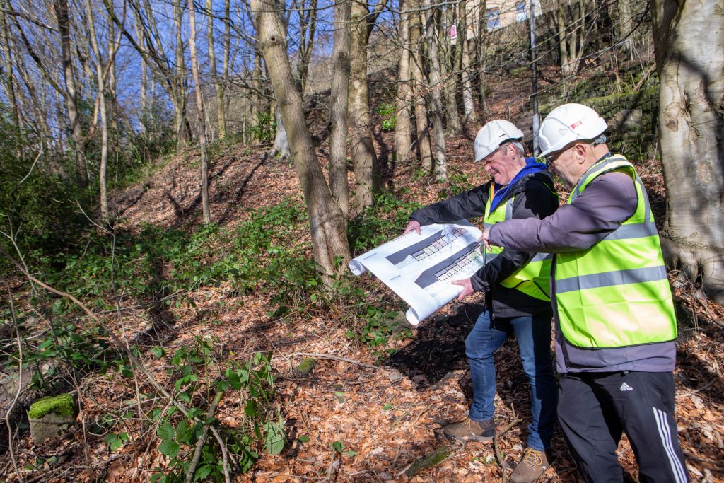 Calder Valley CLT members looking at the site for a new social housing development in Hebden Bridge